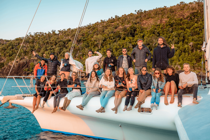 a group of people riding on the back of a boat